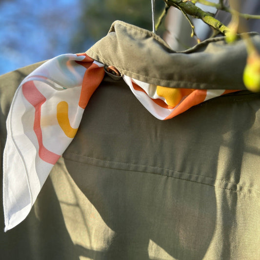 Mozzie Cozzie scarf - in Tropical Summer Earth print on TENCEL by Lenzing AG. Easy to secure under your Mozzie Cozzie jumpsuit collar and plenty of ways to wear in your hair, around your neck, around your wrist, as a decorative edition to your handbag or as a wrap around your wrist. 50cm by 50cm.